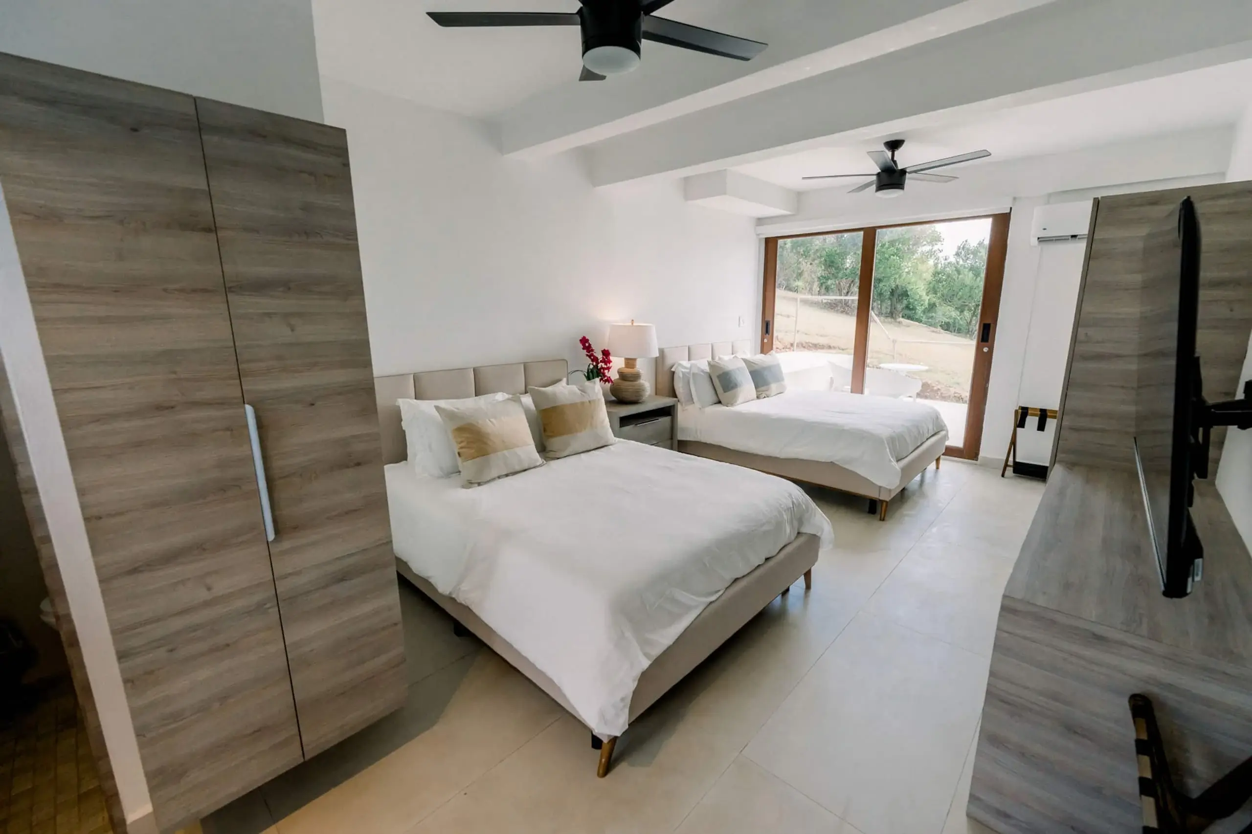 Ground-floor bedroom with two queen beds