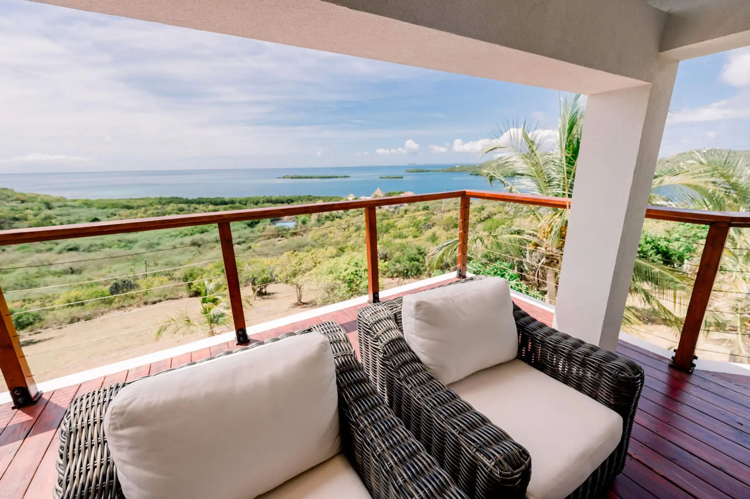 Balcony lounge chairs facing the sea