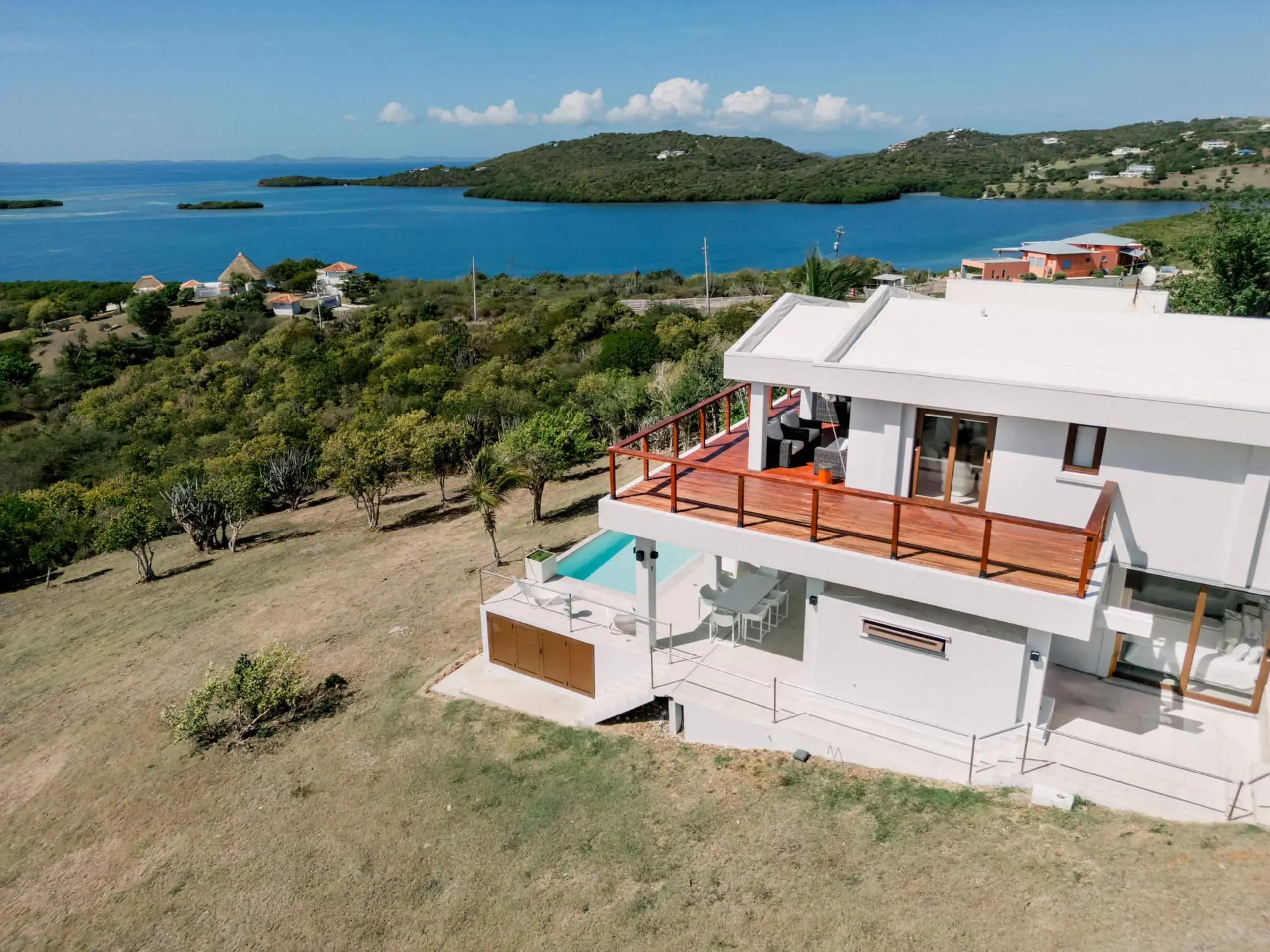 Aerial view of the villa with ocean behind
